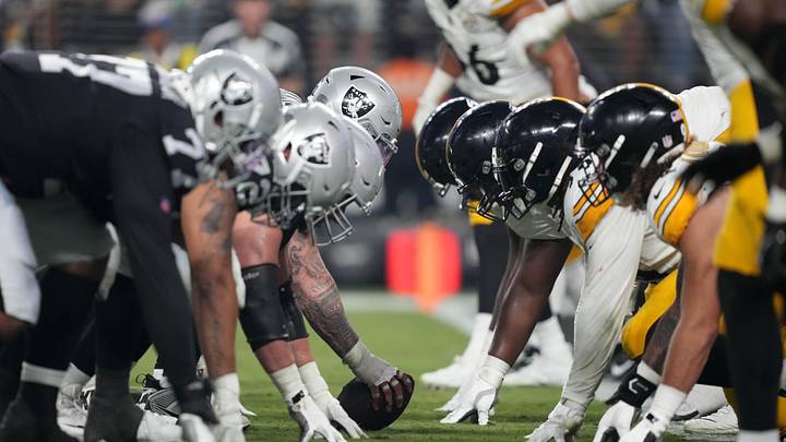 Sep 24, 2023; Paradise, Nevada, USA; A general overall ivew of helmets at the line of scrimmage as Las Vegas Raiders center Andre James (68) snaps the ball against the Pittsburgh Steelers at Allegiant Stadium. Mandatory Credit: Kirby Lee-USA TODAY Sports Sep 24, 2023; Paradise, Nevada, USA; A general overall ivew of helmets at the line of scrimmage as Las Vegas Raiders center Andre James (68) snaps the ball against the Pittsburgh Steelers at Allegiant Stadium. Mandatory Credit: Kirby Lee-USA TODAY Sports