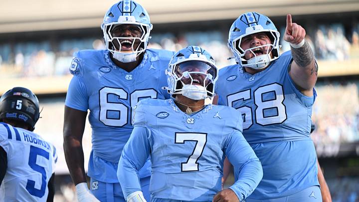 Nov 22, 2025; Chapel Hill, North Carolina, USA; North Carolina Tar Heels quarterback Gio Lopez (7) celebrates after scoring a touchdown during the first half against Duke Blue Devils at Kenan Stadium. Mandatory Credit: William Howard-Imagn Images Nov 22, 2025; Chapel Hill, North Carolina, USA; North Carolina Tar Heels quarterback Gio Lopez (7) celebrates after scoring a touchdown during the first half against Duke Blue Devils at Kenan Stadium. Mandatory Credit: William Howard-Imagn Images