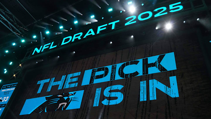 The Carolina Panthers logo is projected on the video board during the NFL Draft 