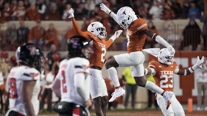 Nov 24, 2023; Austin, Texas, USA; Texas Longhorns defensive backs Terrance Brooks (8) and Derek Williams Jr. (2) celebrate after Brooks made an interception during the first half against the Texas Tech Red Raiders at Darrell K Royal-Texas Memorial Stadium. Mandatory Credit: Scott Wachter-Imagn Images Nov 24, 2023; Austin, Texas, USA; Texas Longhorns defensive backs Terrance Brooks (8) and Derek Williams Jr. (2) celebrate after Brooks made an interception during the first half against the Texas Tech Red Raiders at Darrell K Royal-Texas Memorial Stadium. Mandatory Credit: Scott Wachter-Imagn Images