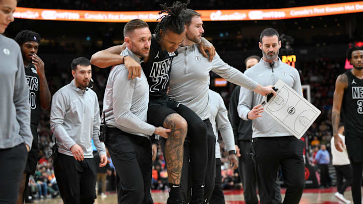 Jan 1, 2025; Toronto, Ontario, CAN; Brooklyn Nets forward Maxwell Lewis (27) is carried off the floor after suffering an injury against the Toronto Raptors in the second half at Scotiabank Arena. Mandatory Credit: Dan Hamilton-Imagn Images Jan 1, 2025; Toronto, Ontario, CAN; Brooklyn Nets forward Maxwell Lewis (27) is carried off the floor after suffering an injury against the Toronto Raptors in the second half at Scotiabank Arena. Mandatory Credit: Dan Hamilton-Imagn Images