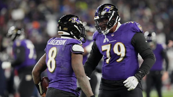 Jan 20, 2024; Baltimore, MD, USA; Baltimore Ravens quarterback Lamar Jackson (8) celebrates with offensive tackle Ronnie Stanley (79) after scoring a touchdown against the Houston Texans during the third quarter of a 2024 AFC divisional round game at M&T Bank Stadium. Mandatory Credit: Mitch Stringer-Imagn Images