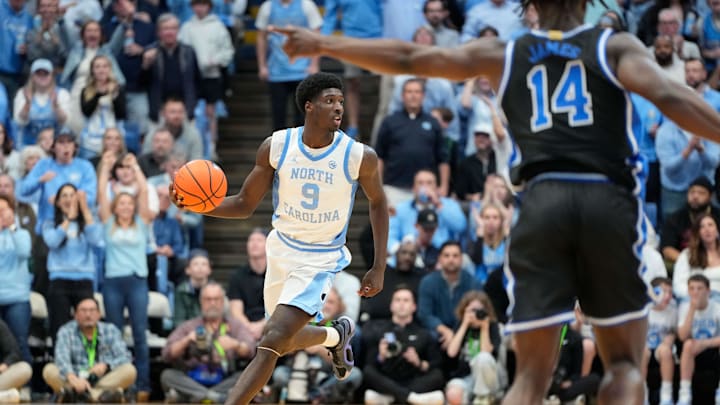 Mar 8, 2025; Chapel Hill, North Carolina, USA;  North Carolina Tar Heels guard Drake Powell (9) brings the ball up the court in the second half at Dean E. Smith Center. Mandatory Credit: Bob Donnan-Imagn Images