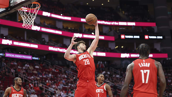 Apr 2, 2025; Houston, Texas, USA; Houston Rockets center Alperen Sengun (28) grabs a rebound during the first quarter against the Utah Jazz at Toyota Center. Mandatory Credit: Troy Taormina-Imagn Images