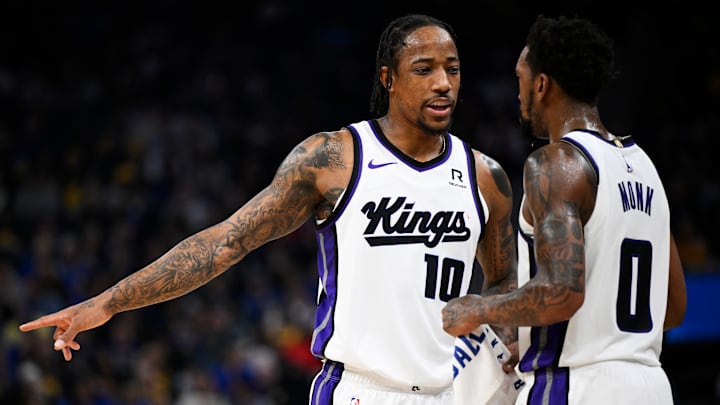 Sacramento's DeMar DeRozan (left) and Malik Monk (right) versus Golden State Warriors