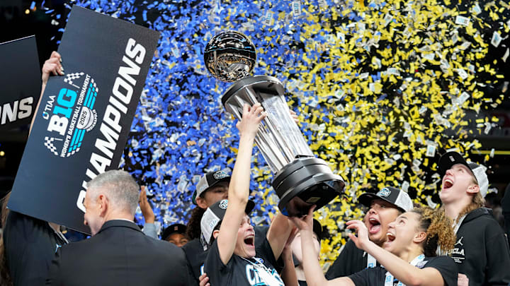 UCLA Bruins players celebrate after defeating the USC Trojans during the 2025 TIAA Big Ten Women's Basketball Tournament.