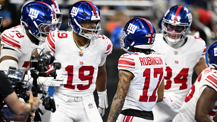 Nov 23, 2025; Detroit, Michigan, USA; New York Giants wide receiver Wan'Dale Robinson (17) celebrates a touchdown with New York Giants quarterback Jameis Winston (19) in the first quarter against the Detroit Lions at Ford Field.  