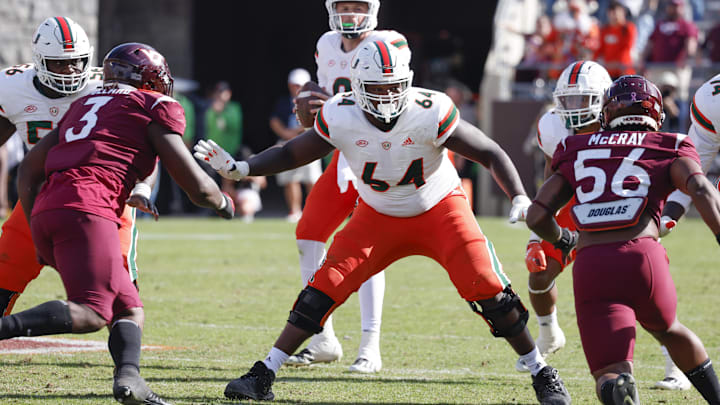 Oct 15, 2022; Blacksburg, Virginia, USA;  Miami Hurricanes offensive lineman Jalen Rivers (64) guards the line against Virginia Tech Hokies defensive linemen Norell Pollard (3) and C.J. McCray (56) during the second half at Lane Stadium. Mandatory Credit: Reinhold Matay-USA TODAY Sports