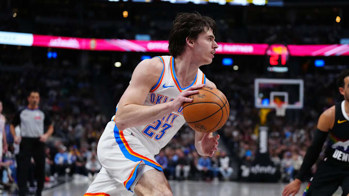 Apr 10, 2026; Denver, Colorado, USA; Oklahoma City Thunder forward Brooks Barnhizer (23) controls the ball in the first quarter against the Denver Nuggets at Ball Arena. Mandatory Credit: Ron Chenoy-Imagn Images