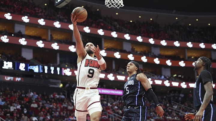 Mar 10, 2025; Houston, Texas, USA; Houston Rockets forward Dillon Brooks (9) shoots the ball as Orlando Magic forward Paolo Banchero (5) defends during the second quarter at Toyota Center. Mandatory Credit: Troy Taormina-Imagn Images