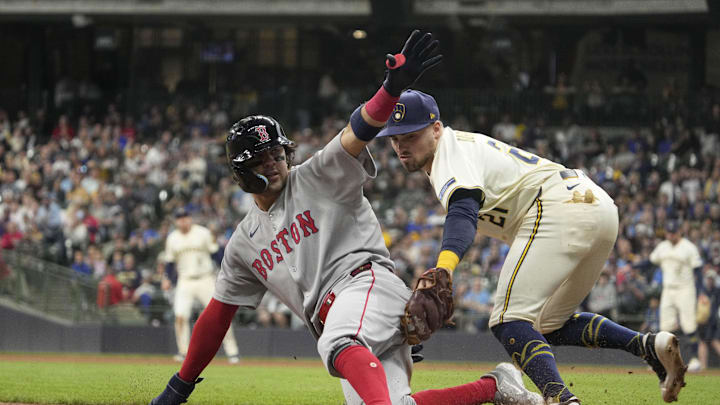 Milwaukee Brewers third base Caleb Durbin (21) tags out Boston Red Sox shortstop Marcelo Mayer (39) as he attempts to steal third base in the fifth inning at American Family Field on May 27.