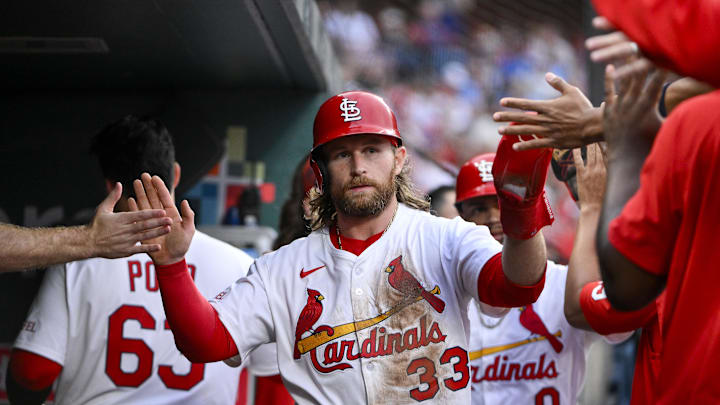 Jun 5, 2025; St. Louis, Missouri, USA;  St. Louis Cardinals second baseman Brendan Donovan (33) is congratulated by teammates after scoring against the Kansas City Royals during the third inning at Busch Stadium. Mandatory Credit: Jeff Curry-Imagn Images