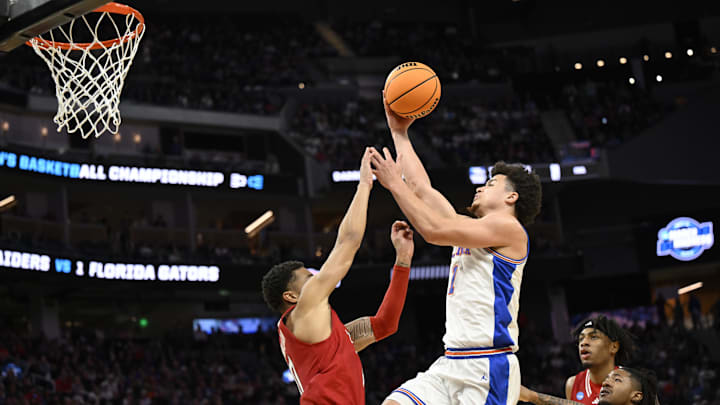 Mar 29, 2025; San Francisco, CA, USA; Florida Gators guard Walter Clayton Jr. (1) drives to the hoop past Texas Tech Red Raiders guard Chance McMillian (0) during the first half of the West Regional final of the 2025 NCAA tournament at Chase Center. Clayton finished with a game-high 30 points. Mandatory Credit: Eakin Howard-Imagn Images