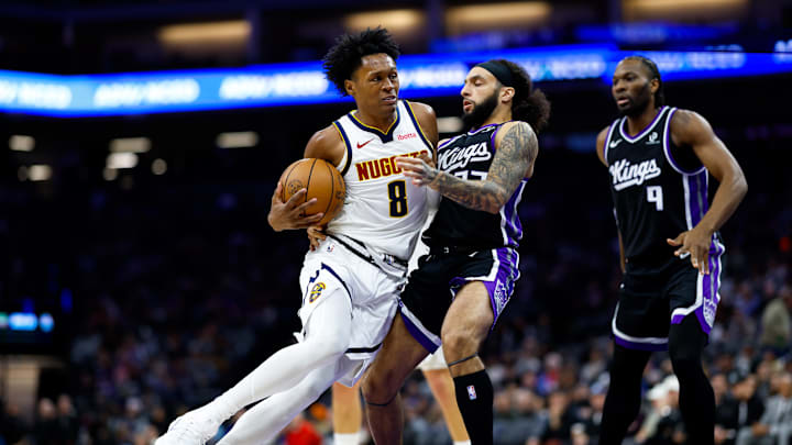 Dec 11, 2025; Sacramento, California, USA; Denver Nuggets guard Peyton Watson (8) drives to the basket against Sacramento Kings guard Devin Carter (22) during the third quarter at Golden 1 Center. Mandatory Credit: Sergio Estrada-Imagn Images Dec 11, 2025; Sacramento, California, USA; Denver Nuggets guard Peyton Watson (8) drives to the basket against Sacramento Kings guard Devin Carter (22) during the third quarter at Golden 1 Center. Mandatory Credit: Sergio Estrada-Imagn Images
