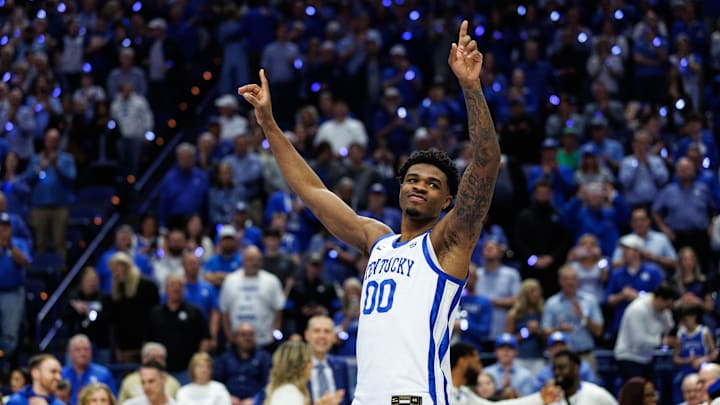 Mar 7, 2026; Lexington, Kentucky, USA; Kentucky Wildcats guard Otega Oweh (00) waves to the crowd during the senior day ceremony before the game against the Florida Gators at Rupp Arena at Central Bank Center. Mandatory Credit: Jordan Prather-Imagn Images