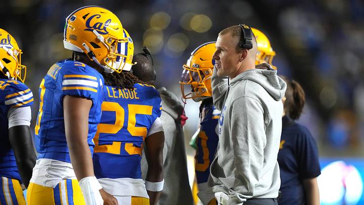 Cal quarterback Jaron-Keawe Sagapolutele speaks with offensive play-caller Pat McCann Cal quarterback Jaron-Keawe Sagapolutele speaks with offensive play-caller Pat McCann