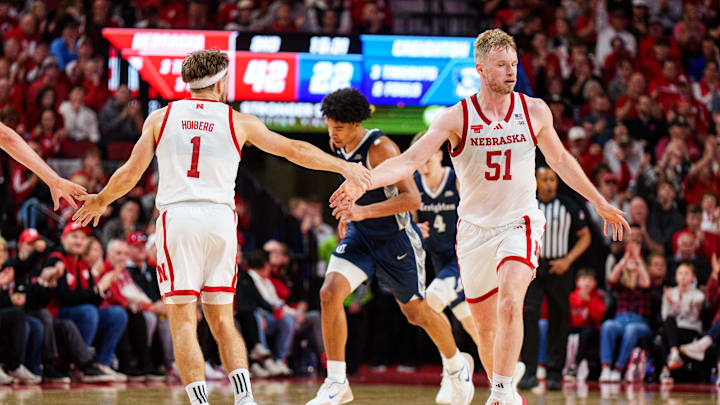 Nebraska guard Sam Hoiberg (1) congratulates forward Rienk Mast for his three-pointer against Creighton on Sunday.