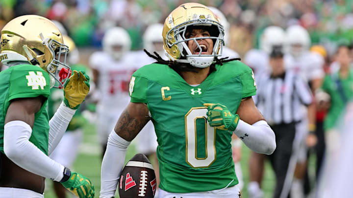 Sep 28, 2024; South Bend, Indiana, USA; Notre Dame Fighting Irish safety Xavier Watts (0) celebrates after an interception against the Louisville Cardinals in the second quarter at Notre Dame Stadium. Mandatory Credit: Matt Cashore-Imagn Images