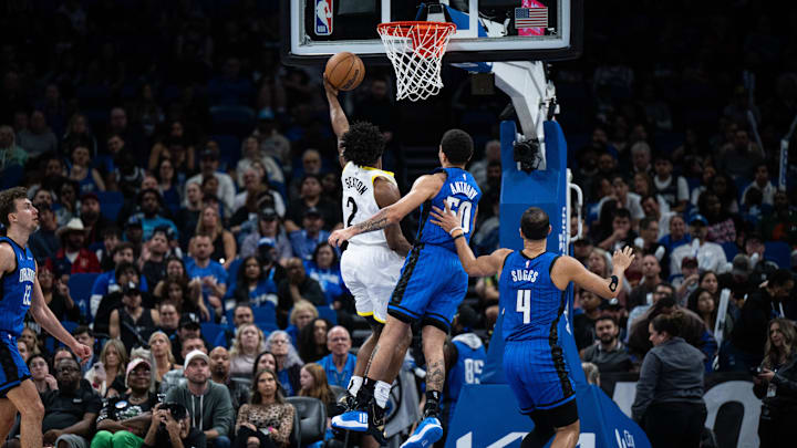 Utah Jazz guard Collin Sexton (2) lays the ball in over Orlando Magic guard Cole Anthony (50) in the second quarter at Kia Center. Mandatory Credit: Utah Jazz guard Collin Sexton (2) lays the ball in over Orlando Magic guard Cole Anthony (50) in the second quarter at Kia Center. Mandatory Credit: