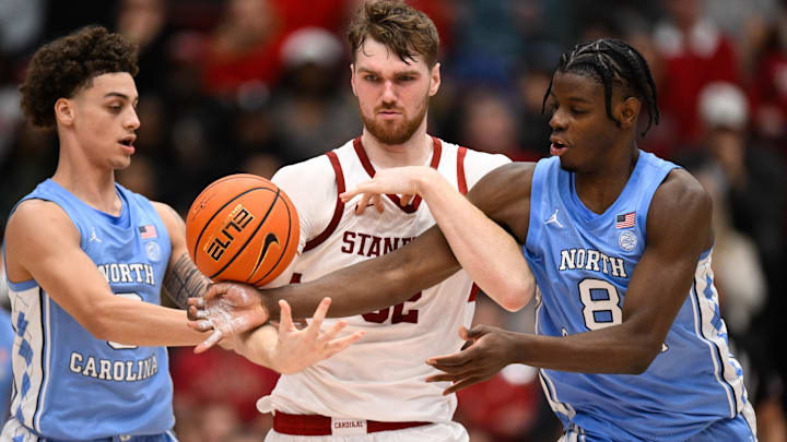 Jan 14, 2026; Stanford, California, USA; North Carolina Tar Heels forward Caleb Wilson (8), guard Kyan Evans (0), and Stanford Cardinal forward Aidan Cammann (52) reach for a loose ball in the second half at Maples Pavilion. Mandatory Credit: Eakin Howard-Imagn Images