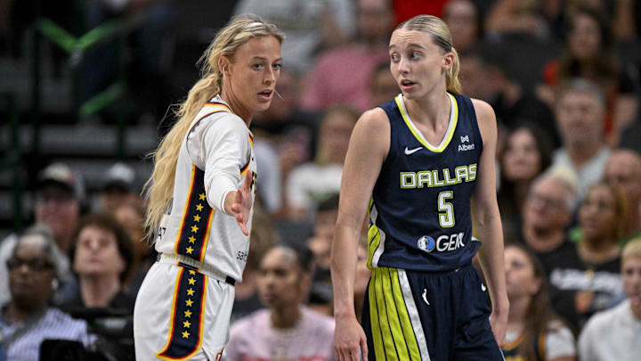 Aug 1, 2025; Dallas, Texas, USA; Dallas Wings guard Paige Bueckers (5) and Indiana Fever guard Sophie Cunningham (8) in action during the game between the Dallas Wings and the Indiana Fever at the American Airlines Center. Mandatory Credit: Jerome Miron-Imagn Images
