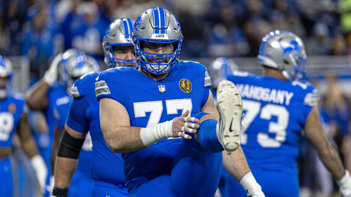 Nov 28, 2024; Detroit, Michigan, USA; Detroit Lions center Frank Ragnow (77) stretches before the game against the Chicago Bears at Ford Field. Mandatory Credit: David Reginek-Imagn Images