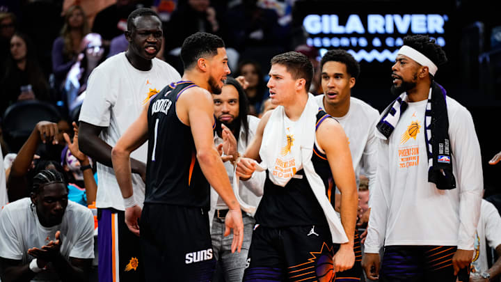 Oct 31, 2025; Phoenix, Arizona, USA;  Phoenix Suns guard Devin Booker (1) and the Suns bench react to a three-point shot by Booker in the second half between the Phoenix Suns and the Utah Jazz at Mortgage Matchup Center. Mandatory Credit: Arianna Grainey-Imagn Images