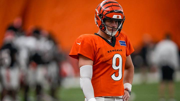 Cincinnati Bengals quarterback Joe Burrow (9) warms up before a preseason training camp practice in downtown Cincinnati on Thursday, July 31, 2025. Cincinnati Bengals quarterback Joe Burrow (9) warms up before a preseason training camp practice in downtown Cincinnati on Thursday, July 31, 2025.