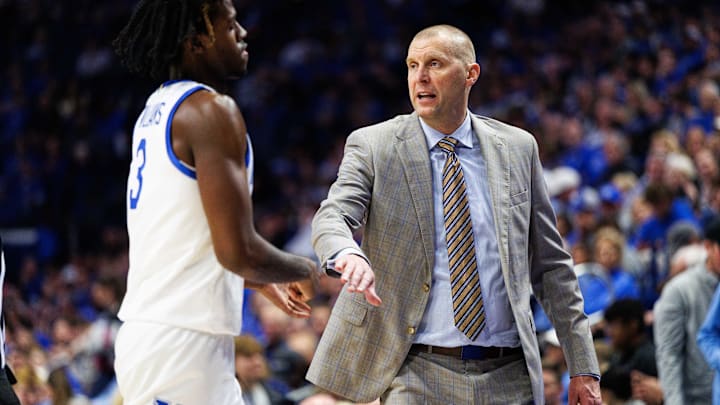 Nov 7, 2025; Lexington, Kentucky, USA; Kentucky Wildcats head coach Mark Pope fives guard Kam Williams (3) as he returns to the bench during the first half against the Valparaiso Beacons at Rupp Arena at Central Bank Center. Mandatory Credit: Jordan Prather-Imagn Images