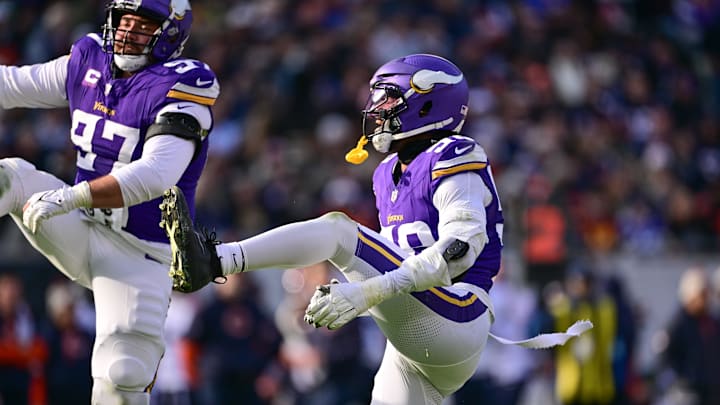 Nov 24, 2024; Chicago, Illinois, USA; Minnesota Vikings linebacker Jonathan Greenard (58) celebrates his sack against the Chicago Bears during the second quarter at Soldier Field.