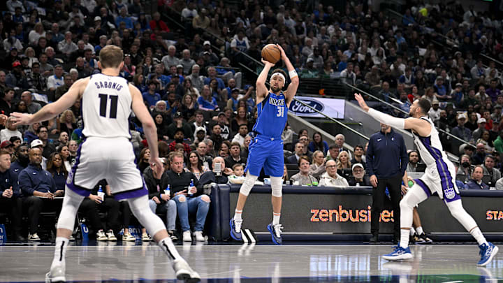 Feb 10, 2025; Dallas, Texas, USA; Dallas Mavericks guard Klay Thompson (31) makes a three point shot against the Sacramento Kings during the second quarter at the American Airlines Center. Mandatory Credit: Jerome Miron-Imagn Images