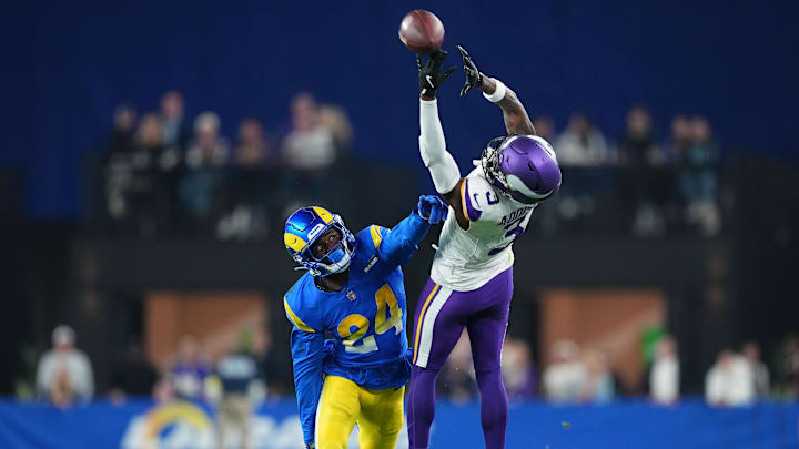 Jan 13, 2025; Glendale, AZ, USA; Minnesota Vikings wide receiver Jordan Addison (3) attempts to make a catch against Los Angeles Rams cornerback Darious Williams (24) during the second half in an NFC wild card game at State Farm Stadium. 
