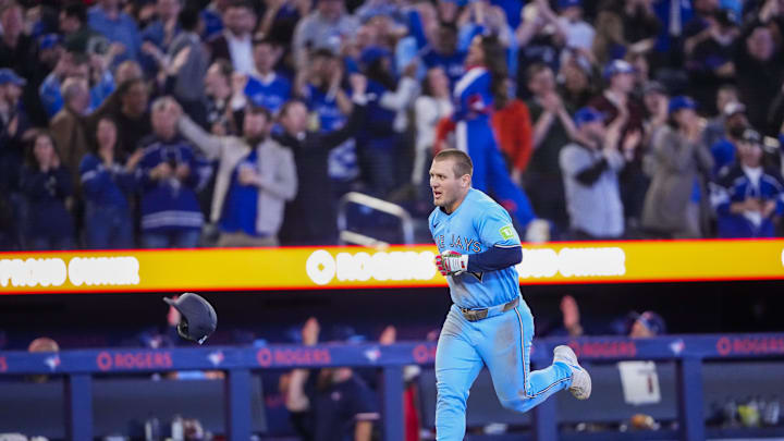 Toronto Blue Jays center fielder Daulton Varsho celebrates hitting a grand slam. Toronto Blue Jays center fielder Daulton Varsho celebrates hitting a grand slam.