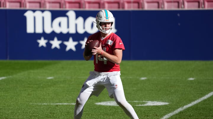 Nov 12, 2025; Madrid, Spain; Miami Dolphins quarterback Quinn Ewers (14) throws the ball during practice at Estadio Riyadh Air Metropolitano. Mandatory Credit: Kirby Lee-Imagn Images