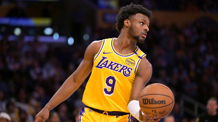 Mar 19, 2025; Los Angeles, California, USA;  Los Angeles Lakers guard Bronny James (9) inbound the ball in the second half against the Denver Nuggets at Crypto.com Arena. Mandatory Credit: Jayne Kamin-Oncea-Imagn Images