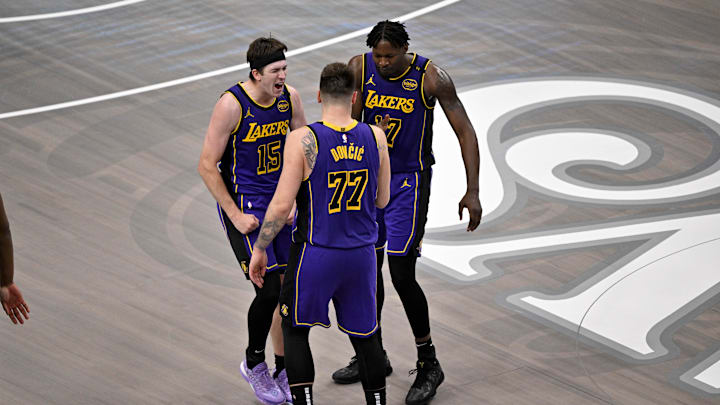 Apr 9, 2025; Dallas, Texas, USA; Los Angeles Lakers guard Luka Doncic (77) and guard Austin Reaves (15) and forward Dorian Finney-Smith (17) celebrate during the fourth quarter against the Dallas Mavericks at the American Airlines Center. Mandatory Credit: Jerome Miron-Imagn Images Apr 9, 2025; Dallas, Texas, USA; Los Angeles Lakers guard Luka Doncic (77) and guard Austin Reaves (15) and forward Dorian Finney-Smith (17) celebrate during the fourth quarter against the Dallas Mavericks at the American Airlines Center. Mandatory Credit: Jerome Miron-Imagn Images