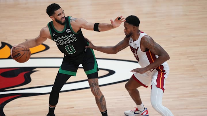 Apr 27, 2024; Miami, Florida, USA; Boston Celtics forward Jayson Tatum (0) directs the offense as Miami Heat forward Haywood Highsmith (24) defends in the second half during game three of the first round for the 2024 NBA playoffs at Kaseya Center. Mandatory Credit: Jim Rassol-Imagn Images