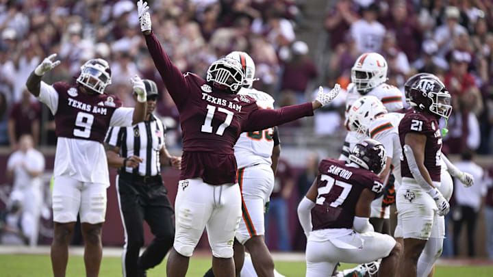 Dec 20, 2025; College Station, TX, USA; Texas A&M Aggies defensive tackle Albert Regis (17) celebrates after tackling Miami Hurricanes running back Mark Fletcher Jr. (4) during first half of the first round game of the CFP National Playoff at Kyle Field. Mandatory Credit: Jerome Miron-Imagn Images