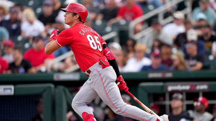 Cincinnati Reds infielder Tyler Callihan hits a two-run home run in the eighth inning during a MLB spring training baseball game, Saturday, Feb. 24, 2024, at Goodyear Ballpark in Goodyear, Ariz.