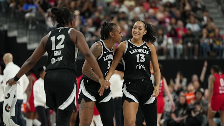Jun 22, 2025; Las Vegas, Nevada, USA; Las Vegas Aces guard Aaliyah Nye (13) celebrates with Tiffany Mitchell (3) and Chelsea Gray (12) after scoring against the Indiana Fever during the second half of a WNBA basketball game at T-Mobile Arena. 