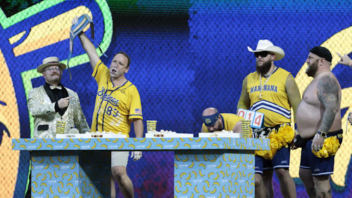 Joey Chestnut (second from left) wins the banana dog eating contest during the Savanah Bananas game. Joey Chestnut (second from left) wins the banana dog eating contest during the Savanah Bananas game.