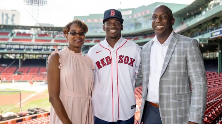 Conrad Cason with his parents at Fenway Park after signing his first professional contract with the Boston Red Sox 