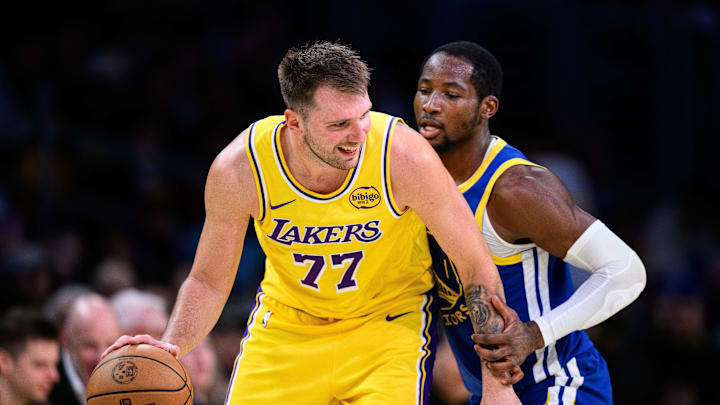 Oct 21, 2025; Los Angeles, California, USA; Los Angeles Lakers guard Luka Doncic (77) looks to drive against Golden State Warriors forward Jonathan Kuminga (1) during the second half at Crypto.com Arena. Mandatory Credit: William Liang-Imagn Images Oct 21, 2025; Los Angeles, California, USA; Los Angeles Lakers guard Luka Doncic (77) looks to drive against Golden State Warriors forward Jonathan Kuminga (1) during the second half at Crypto.com Arena. Mandatory Credit: William Liang-Imagn Images