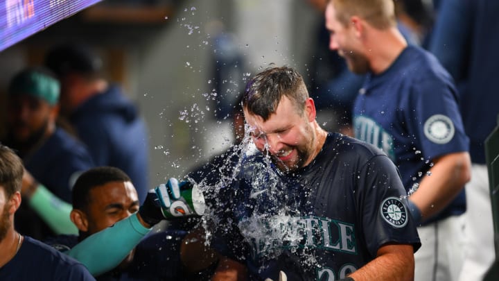 Seattle Mariners catcher Cal Raleigh (29) celebrates with teammates after hitting a walk-off grand slam against the Chicago White Sox during the ninth inning at T-Mobile Park on June 10.