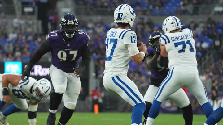 Aug 7, 2025; Baltimore, Maryland, USA; Indianapolis Colts quarterback Daniel Jones (17) pressured by Baltimore Ravens lineman C.J. Okoye (97) during the second quarter at M&T Bank Stadium. Mandatory Credit: Mitch Stringer-Imagn Images