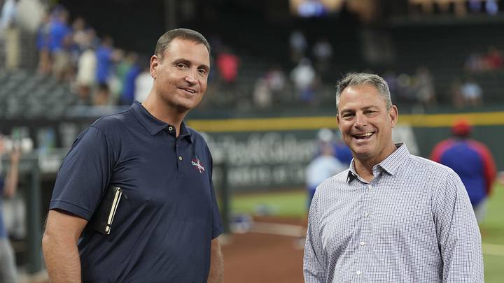 Jun 21, 2024; Arlington, Texas, USA; Texas Rangers general manager Chris Young (left) and Kansas City Royals general manager J.J. Picollo (right) talk before the game against the Kansas City Royals at Globe Life Field. Mandatory Credit: Jim Cowsert-Imagn Images