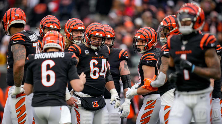Ted Karras and the Bengals offensive line awaits a play from quarterback Jake Browning (6) in the second quarter of the NFL Week 18 game between the Cincinnati Bengals and the Cleveland Browns at Paycor Stadium in downtown Cincinnati on Sunday, Jan. 7, 2024.