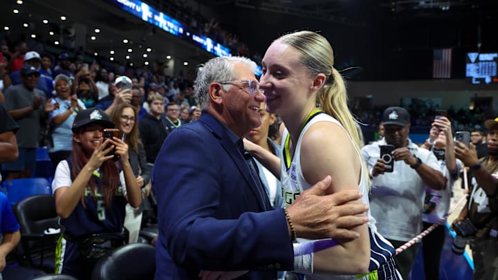 Jun 17, 2025; Arlington, Texas, USA;  University of Connecticut head coach Geno Auriemma hugs Dallas Wings guard Paige Bueckers (5) after the game against the Golden State Valkyries at College Park Center. Mandatory Credit: Kevin Jairaj-Imagn Images