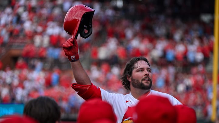 Mar 26, 2026; St. Louis, Missouri, USA; St. Louis Cardinals first baseman Alec Burleson (41) salutes the fans as he receives a curtain call after hitting a go ahead two run home run against the Tampa Bay Rays during the sixth inning at Busch Stadium. Mandatory Credit: Jeff Curry-Imagn Images