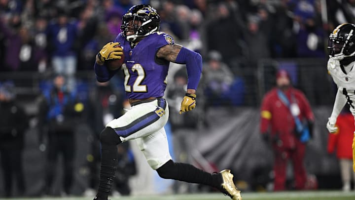 Jan 11, 2025; Baltimore, Maryland, USA; Baltimore Ravens running back Derrick Henry (22) runs to score a touchdown against the Pittsburgh Steelers in the third quarter in an AFC wild card game at M&T Bank Stadium. Mandatory Credit: Tommy Gilligan-Imagn Images